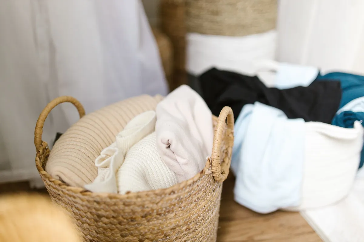 Soft clothes in woven baskets create a cozy setting, highlighting the importance of a well-functioning dryer.